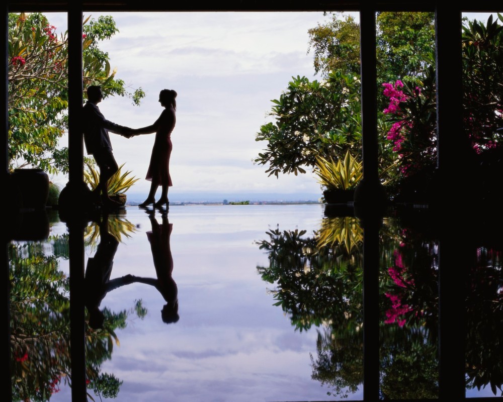 Water Reflecting Silhouette of Couple